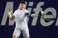 Koepfer hits a forehand in the quarterfinals